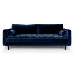 a blue velvet couch with wooden legs and arm rests on an isolated white background,