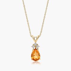 14K Yellow Gold Pear Shaped Citrine & Tri-Diamond Pendant Necklace. Channel your inner royal in this luxurious pendant necklace. Featuring a beautiful pear shaped gemstone with three diamonds at its top, this expertly crafted necklace exudes elegance. Pair it with the matching earrings for the ultimate shine. Luxury Pear-shaped Gemstone Necklace, Fine Jewelry Pear-shaped Diamond Necklace With Gemstone, Pear-shaped Gemstone Diamond Necklace As Gift, Yellow Gold Pear-shaped Diamond Necklace With Gemstone, Pear-shaped Gemstone Diamond Necklace Gift, Pear-shaped Diamond Necklace For Gift, Fine Jewelry Teardrop Gemstone Diamond Necklace, Diamond Teardrop Necklace With Gemstone Accents, Teardrop Diamond Necklace With Gemstone Accents