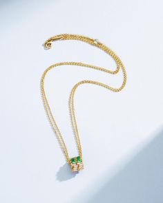 Crafted in 18-karat gold, this necklace features a double row rondelle pendant set with emerald and white diamond baguettes. Designed with two 18-inch chains, this necklace combines simplicity with sophisticated layering. Details 18k yellow gold 1.00 carat of emerald baguettes 1.00 carat of white diamond baguettes Double chain measures 18" inches, adjustable at 16" inches Lobster clasp fastening 12mm diameter 10mm width Ref: BAP862DE Luxury Gold Baguette Cut Emerald Necklace, Elegant Formal Baguette-cut Emerald Necklace, Luxury Baguette-cut Emerald Necklace For Formal Occasions, Yellow Gold Diamond Emerald Pendant Necklace, Luxury Hand-strung Rondelle Emerald Necklace, Double Chain, Baguette Diamond, Emerald Diamond, Pendant Set