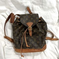 Vintage Louis Vuitton Backpack Bag Montsouris Mm Mongram, Lv. Rare And No Longer Sold. It Does Need Repair At The Bottom Strap Just To Get The D Ring Attached To The Leather On The Bag. Not A Tough Fix But I Haven’t Taken It Out To A Bag Repair. The Drawstring Isn’t It’s Original But I Bought A Generic Leather Replacement As Shown In Pics. I Believe This Is The Mm Size. 10.6” Height, 9.8” Width 4” Deep. I’ll Take Offers Cause I Understand There’s Wear To This Backpack. Louis Vuitton Backpack, Bags Vintage, Backpack Bag, I Understand, Vintage Louis Vuitton, Louis Vuitton Bags, D Ring, Backpack Bags, Bag Lady