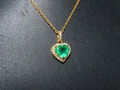 Heart-shaped Emerald Necklaces For Anniversary, Heart-shaped Emerald Necklace For Anniversary, Anniversary Heart-shaped Emerald Necklace, Elegant Green Heart Cut Jewelry, Emerald Heart Cut Necklace For Anniversary, Heart Cut Emerald Necklace For Anniversary, Heart Cut Emerald Jewelry In Yellow Gold, Elegant Heart Cut Emerald Jewelry, Emerald Jewelry For Valentine's Day Gift