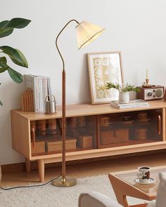 a living room scene with focus on the floor lamp and bookshelf in the background