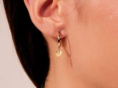 These gorgeous droplet huggers are sure to please! The stunning gold color and inspirational heart droplet ensures that you will get lots of compliments when wearing these lovely earrings.FEATURES• Made to Order• Gold Kt: 14k Solid Gold, 18k Solid Gold• Gold Color: Rose Gold, Yellow Gold, White Gold• Width x Height: 1.90 mm x 22.50 mm�• Inner Diameter: 13.00 mm Huggie Earrings, Lovely Earrings, Gold Heart, Huggies Earrings, Gold Gold, Heart Of Gold, Gold Yellow, Solid Gold, Gold Color