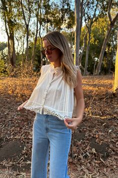 This effortless cottage core eyelet button down top is such a fun flowy style. We love this one styled with your fav denim, cargos for an edgier look or even a trouser for a more polished look. Lined Oversized fit. Chest: 30" Front Length: 20" Back Length: 23" Measurements taken on a size small. Model is wearing a size small. Model is 5’9”, Size 28, Chest 34D, dress size 4. White Casual Top With Boho Collar, White Casual Tops With Boho Collar, Fall Casual Broderie Anglaise Top, Casual Broderie Anglaise Top For Fall, Cottagecore Spring Top With Buttons, Spring Cottagecore Lace Top, Spring Cropped Top With Broderie Anglaise, Daywear Eyelet Button-up Top, Casual Eyelet Blouse For Daywear