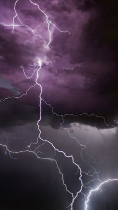 a lightning storm is seen in the sky