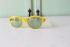 "RARE these are amazing! frame width=6\" arm width=6\" lens width=2.25\" lens height\" 1.5\" Retro & Me loves these sunnies!! one of a kind for sure good vintage condition 1950s-1960s perfect for pool parties love super retro! Thank YOU and please feel free to ask me any ?s:) Have a lovely day!! xoxo www.etsy.com/shop/retroandme #juice" Retro Polarized Sunglasses For Party, Retro Sunglasses With Polarized Lenses For Spring, Retro Sunglasses With Uv Protection For Parties, Retro Sunglasses For Summer Party, Retro Tinted Sunglasses For Spring, Retro Summer Party Sunglasses, Playful Yellow Tinted Sunglasses, Vintage Sunglasses With Uv Protection For Parties, Vintage Yellow Polarized Sunglasses