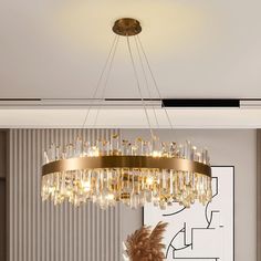 a chandelier hanging from the ceiling in a living room