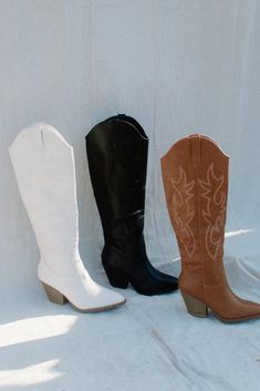 Black Knee High Cowgirl Boots by Pierre Dumas pair these with any shorts, jeans, skirts or dresses classic Western style with a 3" stacked wood heel 15" shaft has the look and feel of leather with black embroidery stitching half zip closure runs a bit large...I normally wear a size 6 but the 5 1/2 fit perfectly we have this one in camel and bone too! Knee High Cowgirl Boots, High Cowgirl Boots, Embroidery Stitching, Black Embroidery, Wood Heel, Black Knees, Western Boot, Medium Dress, Shorts Jeans