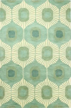 a rug with an abstract design on the front and back of it, in light green