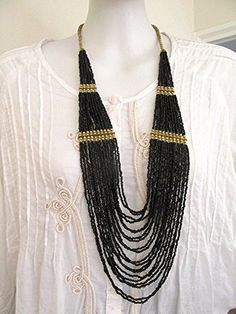 Bohemian Black Multi-strand Beads, Vintage Black Beaded Necklace With Beaded Chain, Black Beads With Gold Details For Festival, Black And Gold Beads For Festival, Vintage Black Beaded Necklace With Colorful Beads, Black Vintage Beaded Necklaces With Colorful Beads, Vintage Black Beaded Chain Necklace, Black Beaded Necklaces With Gold Beads For Festival, Black Beaded Necklace With Gold Beads For Party