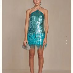 Ok This Dress Is Gorgeous!!! Its A Halter Turquoise Sequin Mini Dress With Ostrich Feather At The Lower Part. Overall Its In A Perfect Condition Apart From Some Missing Beads (As Shown On Picture) On The Right Side Close To Arm Pit. Its Still Have The Tag On It. I Feel Like This Dress Also Perfect For Halloween! Feel Free To Send Me Offer If Youre Interested Sequins, New Year Eve, Fairycore, Fairy Dress, Tinkerbell, Maximalism, Maximalist, Turquoise, Sea, Seafoam, Mermaid, Mermaid Core, Ariel, B Great Neck New York, Mermaid Core, Dress Sequin, Ostrich Feather, New York Style, Cult Gaia, Feather Dress, Fairy Dress, Sequin Mini