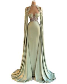 Feel like a queen on our Royal Cape dress. Coronation Dress Queen, Fitted Light Green Prom Dress, Elegant Light Green Fitted Maxi Dress, Elegant Light Green Maxi Dress For Party, Elegant Fitted Light Green Dress, Fitted Light Green Maxi Dress For Party, Elegant Light Green Wedding Gown, Light Green Long Sleeve Party Dress, Queen Dress Royal Medieval