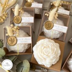 wedding favors in boxes with flowers and feathers