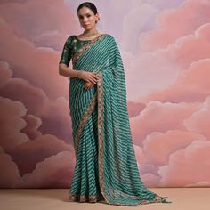 Green colored saree is made from georgette fabric which is highlighted with beautiful printed work as shown. Comes along with unstitched mono silk blouse piece which you can customise as per your design/style. Occasion - You can wear this saree for party, functions and fashionista. Note:- the actual product may differ slightly in color and design from the one illustrated in the images when compared with computer or mobile screen. Measurements: Saree : Georgette : 5.5 Mtrs Blouse : Georgette : 0. Festival Georgette Pre-draped Saree With Printed Border, Fitted Georgette Blouse Piece With Printed Border, Fitted Bollywood Blouse With Printed Border, Bollywood Style Fitted Blouse Piece With Printed Border, Green Georgette Dupatta With Printed Border, Green Georgette Blouse Piece For Navratri, Navratri Green Georgette Blouse Piece, Fitted Saree In Art Silk With Printed Border, Fitted Art Silk Saree With Printed Border