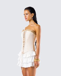 Make them work for it in this lace-up corset top 🤍 Made from canvas fabric and complete with a v-hem and ruffle trim at the front and back neckline - this piece will tie all your looks together 🙌 Spring Strapless Corset With Lace Trim, Spring Stretch Corset With Boned Bodice, Beige Strapless Corset With Corset Back, Strapless Beige Corset With Corset Back, Fitted Beige Corset With Corset Back, Elegant Summer Corset With Lace-up Back, Fitted Lace Trim Corset Belt, Spring Overbust Stretch Corset, Spring Stretch Overbust Corset