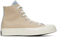 High-top canvas sneakers colorblocked in beige, blue and navy. · Round rubber cap toe · Lace-up closure · Eyelet vents and logo patch at inner side · Canvas lining · Cushioned Ortholite® insole · Rubberized logo patch at heel · Treaded rubber sole Supplier color: Navy/Oat milk/Ocean Navy Chuck 70, Converse Beige, Navy Converse, Sport Shoes Men, Chuck 70, Outdoor Men, Converse Sneakers, Oat Milk, Mens Sportswear