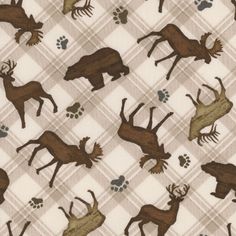 an animal print on fabric with brown and tan colors, including deers and paws