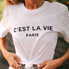 Chic Graphic Short Sleeved Tee In White With Black Casual High Quality Cotton 100% Cotton Longer Length Tee White Letter Print Top For Day Out, Chic Text Print Tops For Spring, Paris Fashion Summer, Yoga Long Sleeve, French Outfit, Paris Logo, White Graphic Tee, Turtleneck Shirt, Cotton Long Sleeve Shirt