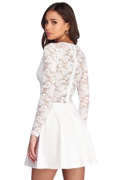 Our lace obsession continues with this beautiful ivory dress! Perfect for any occasion and any season. this dress features a sheer lace bodice with a V neckline. long fitted sleeves. and a discreet back zipper closure. A sweetheart lining and delicate scallop lace trim completes the bodice. The flattering skater skirt is composed of a crepe-like fabric with a moderate stretch. Skirt has no lining. Model is 5'9" with a 33" bust. 24" waist and 35.5" hips. She is wearing a size small. Ivory Dress, Lace Skater Dress, Stretch Skirt, Dressy Dresses, Ivory Dresses, Lace Bodice, Scalloped Lace, Sheer Lace, Skater Dress