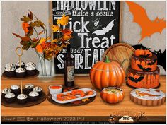 a table filled with halloween treats and desserts