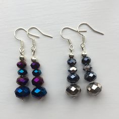 "*Handmade items *Materials: metallic rondelles (blue, purple, black, silver), silver-plated hooks, beaded on earring pins  *Earring length: approximately 1.5\" [4 cm] including the hooks If another length is preferred, contact seller   Includes gift box 4cm x 5cm" Silver Round Crystal Earrings With Dangling Beads, Silver Spacer Beads Drop Earrings, Silver Beaded Earrings With Faceted Beads, Silver Faceted Bead Crystal Earrings For Party, Silver Round Beaded Earrings With Faceted Beads, Silver Crystal Earrings With Dangling Beads, Silver Crystal Earrings With Faceted Beads For Party, Silver Beaded Earrings With Spacer Beads, Silver Dangle Beaded Earrings With Spacer Beads