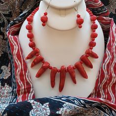 The Necklace And Earring Set Includes Multi Shapes (Stick, Carved And Smooth Rounds) Of Natural Coral With Sterling Silver Findings. The Necklace Is 21 Inches Long And Has A Sterling Silver Hook Clasp. The Set Also Includes A Beautiful Reversible Hand-Made Cotton Scarf From India (33 In. Long And 14 In Wide). The Coral Jewelry Matches One Side Of The Scarf And There Is A Pair Of Earrings That Coordinates With The Reverse Side Of The Scarf. Adjustable Red Coral Jewelry For Jewelry Making, Handmade Red Costume Jewelry Earrings, Handmade Red Coral Dangle Jewelry, Reversible Scarf, The Coral, Natural Coral, Coral Necklace, Coral Jewelry, Necklace And Earring Set