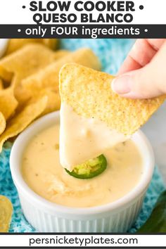 a hand dipping a tortilla chip into a bowl of quesadilla sauce