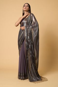 Charcoal saree with metallic sequin embroidered in wave patterns. Comes with sequined unstitched blouse piece. - Aza Fashions Glamorous Embellished Pre-draped Saree For Celebrations, Embellished Georgette Pre-draped Saree For Celebration, Evening Pre-draped Saree With Mirror Work For Eid, Glamorous Georgette Pre-draped Saree For Celebration, Sequin Chinon Pre-draped Saree For Diwali, Festive Silk Pre-draped Saree With Sequins, Eid Evening Pre-draped Saree With Mirror Work, Festive Sequined Pre-draped Georgette Saree, Designer Pre-draped Sequin Saree For Diwali