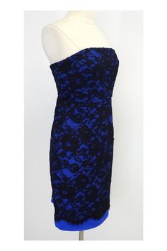 Size 4 Cobalt strapless dress with black lace overlay Body 72% Nylon 28% Polyester Lining 100% Silk Concealed back zip Bone in bodice Across top of bust 14" Under bust 14" Waist 27" Hips 36" Bust to hem 25.5" Total length 28.5" Strapless Fitted Lace Evening Dress, Fitted Strapless Lace Evening Dress, Fitted Strapless Lace Dress For Evening, Blue Formal Lace Dress With Lace Bodice, Strapless Lace Dress For Date Night, Formal Strapless Lace Mini Dress, Blue Lace Dress For Gala, Blue Fitted Lace Evening Dress, Blue Fitted Lace Dress For Evening