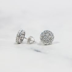 Detials: Material: 10K Gold/White Gold/Rose Gold plating over .925 Sterling Silver base. Stone: VVS Moissanite Size: 10.5mm(W) Timeless Cluster Earrings For Anniversary With Prong Setting, White Gold Moissanite Cluster Earrings, White Gold Moissanite Halo Earrings, Moissanite Cluster Jewelry With Halo Design, Cubic Zirconia Cluster Jewelry With Halo Design, Fine Jewelry Round Cluster Earrings With Vvs Clarity, White Gold Round Cut Cluster Earrings For Anniversary, Vvs Clarity Round Cluster Earrings Fine Jewelry, Dazzling White Gold Cluster Earrings For Anniversary