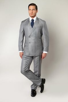 This men's grey double breasted suit has a classic design that has been brought up-to-date with satin trim and rich colors. The trousers are formal and sleek, making this a crisply tailored business suit for men of distinguished taste. Enjoy suave, elegant design that can rival the best Italian suits! Features Includes: Suit jacket, and pants JACKET: Full Lined, 2 X 4 Double breasted, Peak Lapel, Center Vents PANTS: Flat Front, 37 Inch Insteam, unhemmed. Lined to the knee Fit: Slim fit Fabric: P Mens Suits Black, Mens Suits Modern, Man Suits, Traditional Suit, Suits Men Business, Italian Suit, Suit For Men, Men Formal, Fashion Suits