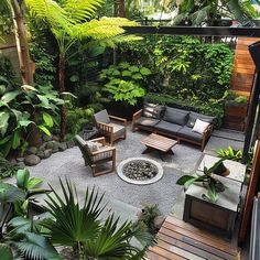 an outdoor living area with lots of plants and furniture