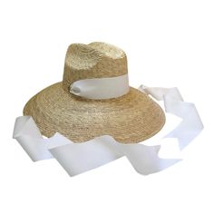 Our elegant take on the boho "lifeguard-style" surfer hat is woven with all-natural palm tree leaves. This sun hat ships woven with a long white grosgrain ribbon. This sun hat is one size fits most and features an elastic interior sweatband. Product Overview: Inner Crown Circumference: 22 inches (55.8 cm) Brim Length: 4.75 inches (12.5 cm) Crown Height: 5.5 inches (14 cm) We ship each order with a foam hat insert (also known as hat filler), that can be stuck behind the interior elastic, which ca White Toquilla Straw Hat Bands For Vacation, White Straw Panama Hat With Short Brim, White Straw Panama Hat With Flat Brim, White Short Brim Straw Panama Hat, White Toquilla Straw Summer Hat, White Coastal Hat For Spring, White Summer Hat Bands For Vacation, White Panama Hat With Curved Brim, Cream Toquilla Straw Hat Bands For Vacation