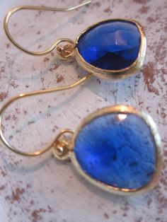 READY TO SHIP! Cobalt Blue Earrings Gold - Bridesmaid Earrings - Wedding Earrings - Valentines Day Gift The blue glass gem is 13mm with 5mm thick at its' widest part. The gem is gold plated. The earwires are gold filled. The length of the earrings is approx 1 inch long. You are sure to stand out in these beautiful earrings! All of my items include a gift box for easy gift-giving for your friends or for yourself! I love custom orders! If you are a looking for a bridesmaid gift, these are perfect. Nickel-free Blue Earrings For Wedding, Blue Drop Bridal Earrings For Celebration, Blue Drop Earrings For Bridal Celebration, Elegant Blue Bridal Earrings For Celebration, Gold Bridesmaid Earrings, Bridesmaid Earrings Gold, Cobalt Blue Earrings, Gold Bridesmaids, Lafayette La