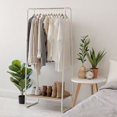 Clothing storage made easy. This metal garment rack with marble wood shelf provides a convenient closet solution for small spaces. The built-in wood shelf at the bottom is great for storing shoes or folded clothes, while the two foot wide closet rack gives you plenty of space to hang your clothes. Available in black or white frames with respective marble patterned wood board, you can mix and match the garment racks to create customizable closet organization to suit your needs. Compliant with CAR Small Space Storage Solutions, Small Guest Room, Space Storage, Small Space Storage, Storage Closet Organization