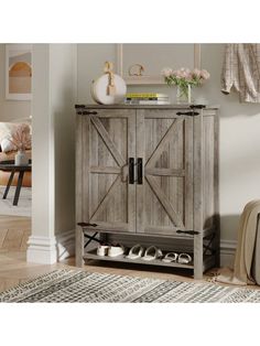 a wooden cabinet with sliding doors in a living room next to a rug on the floor