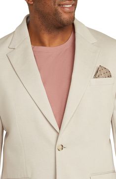 A textured knit made of recycled fibers and breathable cotton relaxes a sport coat that's designed in a neutral beige and styled to elevate any casual look. Notched lapels Nonfunctional four-button cuffs Chest welt pocket; front flap pockets; interior pockets Back vent Lined 55% recycled polyester, 45% cotton Dry clean Imported Casual White Sport Coat With Notch Lapel, Casual Beige Blazer With Lapel Collar, Beige Long Sleeve Sport Coat With Single Button, Beige Cotton Business Blazer, Casual Beige Single-breasted Blazer, Tailored Beige Sport Coat For Spring, Beige Notch Lapel Sport Coat For Spring, Spring Cream Tailored Sport Coat, Cotton Outerwear With Single Button