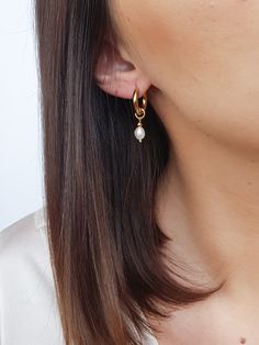 Mini hoop earrings with small pearl charm! These dainty freshwater baroque pearl earrings are perfect addition to you jewelry collection. Mixing all time favorite - hoops and all time classic -pearls, makes these earrings both- beautiful and timeless! It's definitely a must have! You also can take off pearl charms and have plain hoops earrings when needed! Check other pearl earrings here - https://www.etsy.com/shop/GinandJewelryShop?section_id=32608833 Message me if you need larger quantity than Everyday Pearl Drop Dangle Hoop Earrings, Everyday Hoop Earrings With Pearl Charm, Delicate Dangle Hoop Earrings With Pearl Charm, Everyday Hoop Jewelry With Pearl Charm, Everyday Pearl Charm Dangle Huggie Earrings, Everyday Dangle Pearl Earrings With Pearl Charm, Everyday Dangle Pearl Pendant Earrings, Dainty Pearl Charm Drop Earrings, Dangle Earrings With Pearl Charm For Everyday