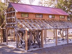 a small wooden structure with a purple roof