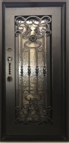 an iron door with decorative designs on the front and side panels, as well as a glass