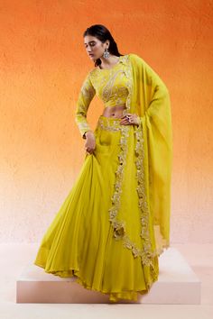 Featuring a daisy yellow lehenga set in georgette base with threadwork, cutdana and moti hand embroidery. It is paired with a matching embroidered georgette blouse and an organza dupatta. Yellow Organza Choli With Intricate Embroidery, Yellow Organza Set With Intricate Embroidery, Yellow Organza Sets With Intricate Embroidery, Yellow Organza Lehenga With Intricate Embroidery, Yellow Organza Sharara With Intricate Embroidery, Yellow Embroidered Organza Set, Yellow Lehenga With Intricate Embroidery In Georgette, Yellow Georgette Anarkali Set With Intricate Embroidery, Yellow Georgette Lehenga With Intricate Embroidery