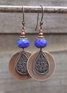 Beautiful cobalt blue, faceted Czech glass with antiqued copper coin drop and filigree teardrop. Very light weight, approx 2 in total length. Blue Pierced Copper Earrings, Blue Copper Pierced Earrings, Blue Teardrop Copper Earrings, Blue Copper Teardrop Earrings, Bohemian Blue Copper Earrings, Bohemian Blue Earrings, Blue Bohemian Teardrop Earrings Nickel Free, Blue Teardrop Brass Earrings, Nickel-free Blue Copper Jewelry