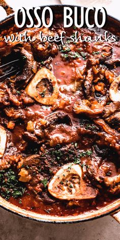 a close up of food in a pan with the words osso buco on it