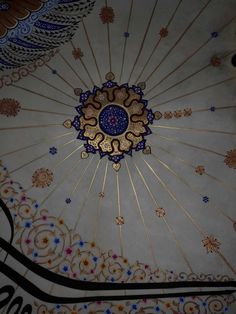 an ornate ceiling with blue and gold designs