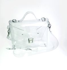 "Please note: We are safe and we fulfill the order as normal, in accordance with the declared deadlines. Clear cute crossbody messenger, security purse for mass parties, concerts, stadium approved transparent handbag, airport security, 90s fashion Dimensions:  23 x 20 x 5 cm / 10,24 x 7,87 x 1,97 inch strap 2 cm( 0,8 inch)  and regular max 140 cm ( 56 inches) Made of thick, crystalline, flexible PVC. A large handbag city , type of messenger bag/ office bag .  Medium transparent messenger bag with solid straps to my fascination with the universe transparent .You can complete your harmony as putting some compatible things with your daily dress into the transparent bag and you are ready to go! It's also good when going through airport security. The unique design allows you to change the chara Cheap Clear Satchel Shoulder Bag, Cheap Trendy Shoulder Bag With Transparent Straps, Cheap Clear Shoulder Bag, Cheap Clear Tote Shoulder Bag, Cheap Clear Plastic Shoulder Bag, Cheap Functional Clear Bags, Cheap Nylon Bag With Clear Strap, Cheap Everyday Bags With Transparent Straps, Cheap Black Shoulder Bag With Clear Strap