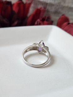 Vintage Inspired Art Deco Amethyst Engagement Ring from Prosebud Jewelry. Featuring a genuine 12x6mm purple amethyst on a 925 sterling silver band.The amethyst, renowned for its captivating deep violet hue, is beautifully complemented by sparkling genuine marcasite accents, enhancing its vintage charm. Crafted from solid sterling silver and marked 925, this ring boasts a substantial weight of 4.7 grams, ensuring durability and timeless appeal. The deco-style swirls on either side of the large am Classic Amethyst Crystal Ring For Anniversary, Amethyst Open Ring With Accent Stones, Lavender Amethyst Promise Rings, Purple Topaz Ring With Center Stone For Promise, Formal Purple Diamond Birthstone Ring, Marquise Amethyst Ring Gemstone Gift, Marquise Amethyst Ring Gift, Gift Marquise Amethyst Ring, Classic Amethyst Purple Rings