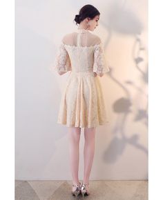 Buy modest champagne lace short homecoming dress sleeved with illusion neckline at wholesale price online. Free shipping and pro custom service since 2009. Cream Lace Dress With Lace Bodice For Party, Beige Short Sleeve Lace Dress For Wedding, Champagne Lace Dress For Prom Season, Beige Lace Dress With Lace Sleeves For Party, Beige Lace Dress With Short Sleeves For Party, Cream Mini Lace Dress For Party, Knee-length Lace Dress With Illusion Neckline For Wedding, Beige Short Sleeve Lace Party Dress, Knee-length Mini Dress With Lace Sleeves For Evening