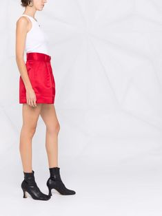 Find STYLAND High-waisted Pleated Shorts on Editorialist. scarlet red satin finish high-waisted wide leg pleat detailing belt loops front button and zip fastening We've partnered with Good On You — an independent agency that rates how brands perform in relation to their impact on the planet, people and animals, with a multi-criteria rating simplified to a five points scale. In order to be awarded our conscious label, larger brands need to score a minimum of four out of five ('Good'), while smaller brands must score at least three out of five ('It's A Start'). This item comes from a brand rated three out of five ('It's A Start') by Good on You at the time it was added on FARFETCH. Please note, this is a brand-level rating and does not guarantee that this product is made with conscious mater Fitted Silk Bottoms Short Length, Fitted High-waisted Shorts For Evening, Party-style Belted Bottoms In Short Length, Chic Satin Short Length Bottoms, Chic Red Silk Bottoms, Red Silk Bottoms For Evening, Red Silk Evening Bottoms, Elegant Red Satin Bottoms, Red Satin Bottoms For Summer