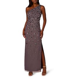 a woman wearing a long dress with sequins on it