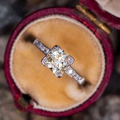 The vintage ring is centered with one (1) old mine cut diamond set into a four-prong head. The shoulders of the ring are each accented with four (4), channel set, round single cut diamonds. The ring measures 6.0mm at the top, rises 5.7mm above the finger, tapering to 1.2mm wide and 0.6mm thick at the base of the shank. The ring is currently a size 3.5 and we offer complimentary resizing to fit. Vintage Single Cut Diamonds Promise Jewelry, Vintage Promise Jewelry With Single Cut Diamonds, Vintage Moissanite Rings For Anniversary, Vintage Cushion Cut Anniversary Rings, Vintage Diamond White Promise Ring, Vintage Diamond Ring With Cushion And Brilliant Cut, Vintage Diamond Ring With Center Stone Cushion Cut, Vintage Diamond White Diamond Ring For Promise, Vintage Cushion Cut Diamond Ring With Brilliant Cut